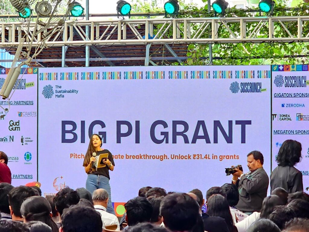 Speaker presenting the Big Pi Grant on stage at SusCrunch 2026, hosted by The Sustainability Mafia